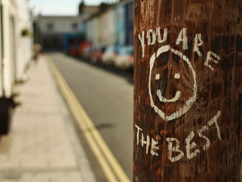 "You are the best" scratched into a street post.